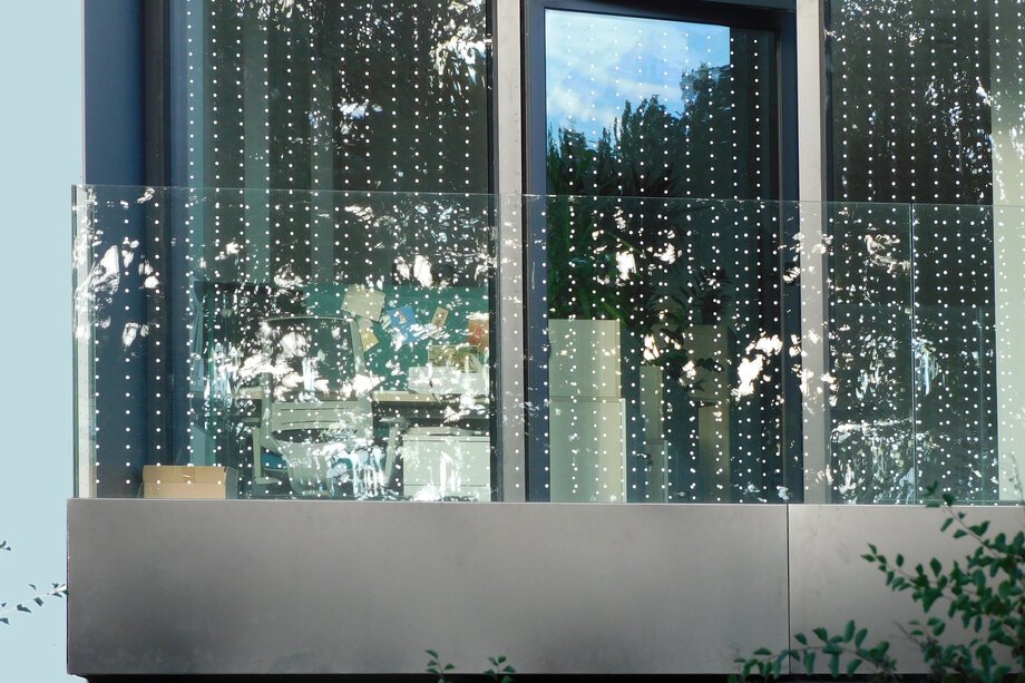 Dotted glass bird collision deterrent on a WWF Poland building